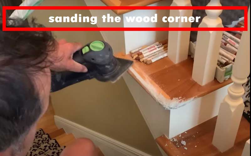 sanding the wood corner
